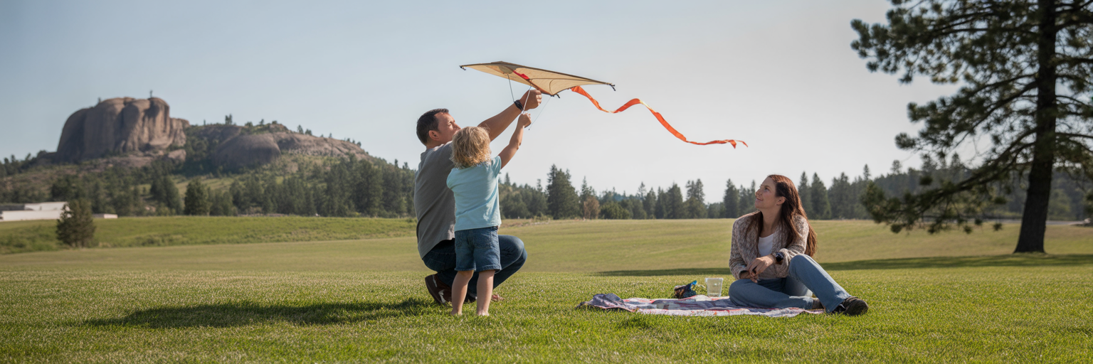 Family flying a kite in Mirabeau Park