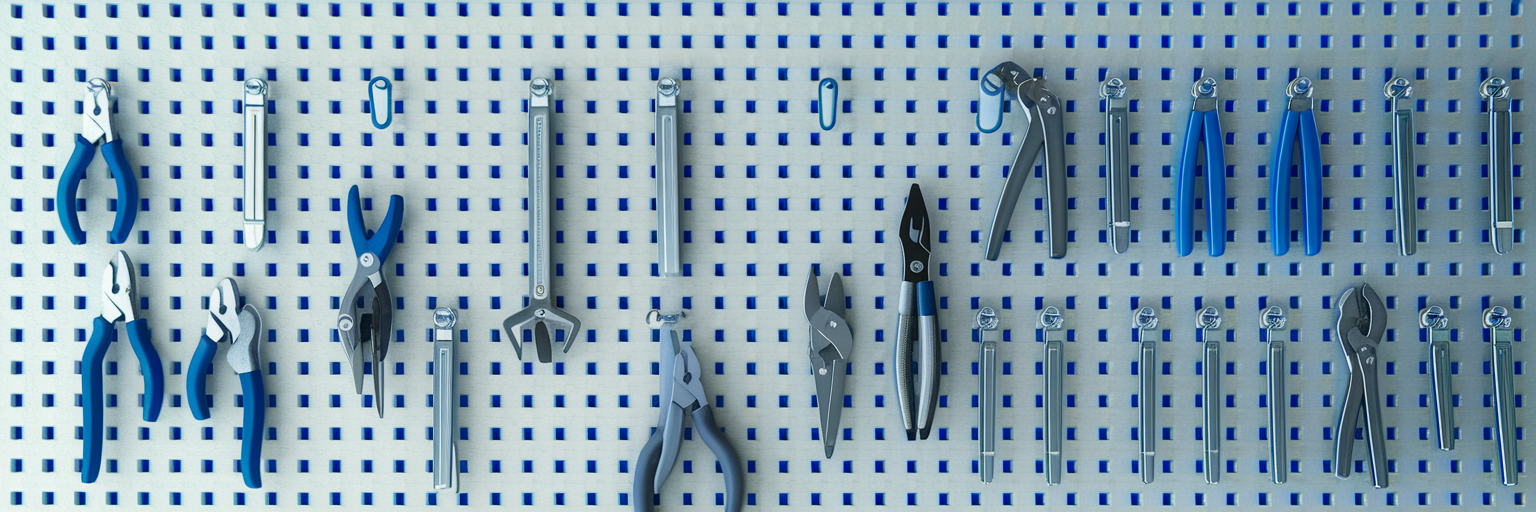 Organized car maintenance tools on a pegboard.